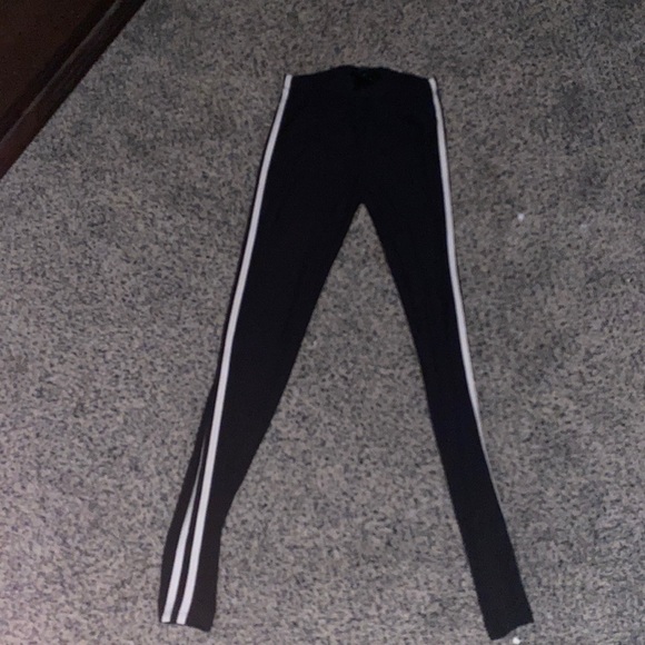 Size small black leggings with two stripes down the side - Picture 1 of 1